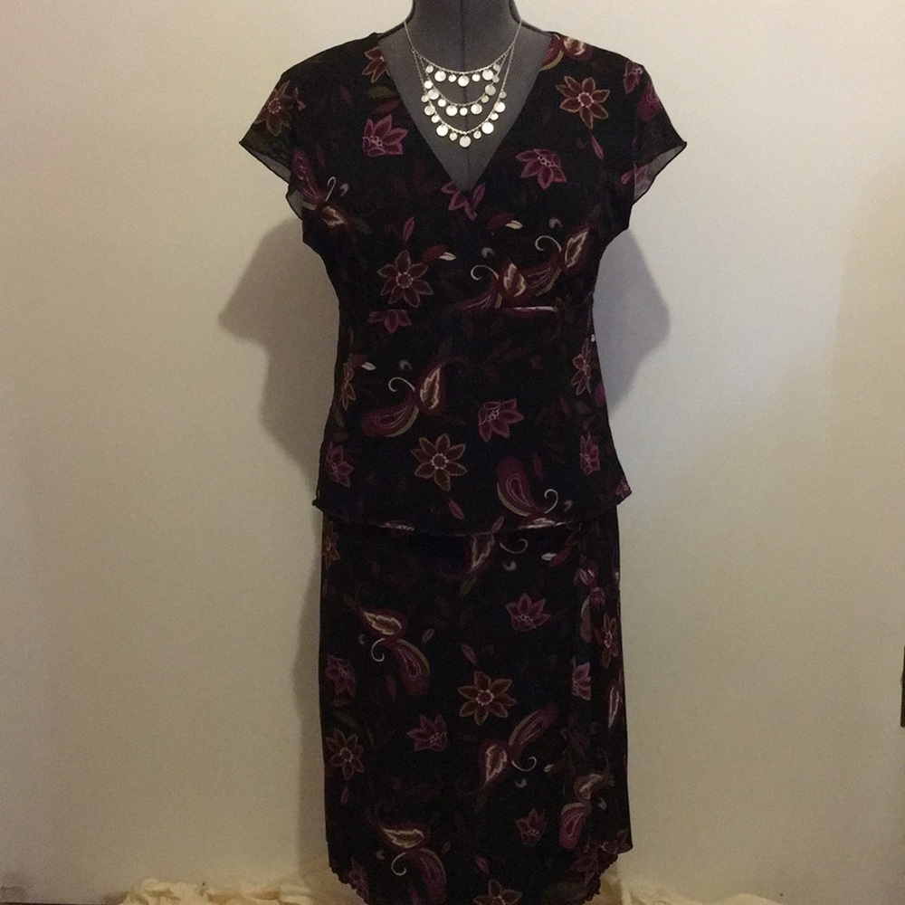This is a two piece set with a blouse and skirt.